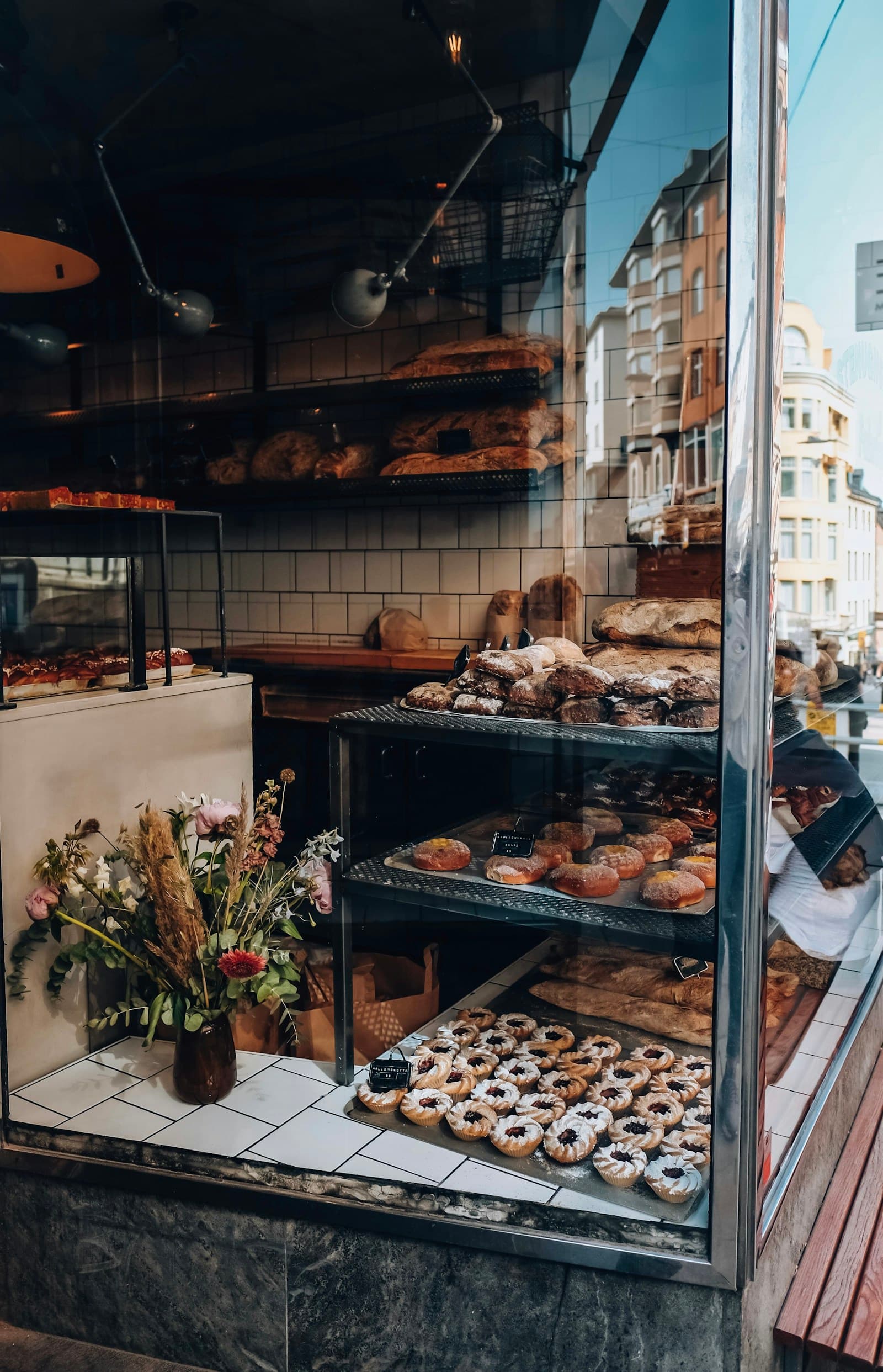 A premium bakery display window at street level